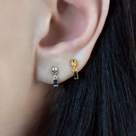 gold stud earrings skull black spinel gemstone