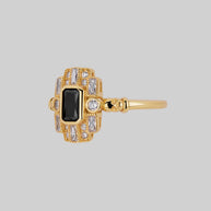 gold cocktail ring black spinel gemstone detailed skulls