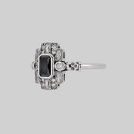 silver cocktail ring black spinel gemstone detailed skulls