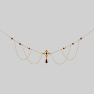 gold fleur-de-lis necklace with garnet and cz