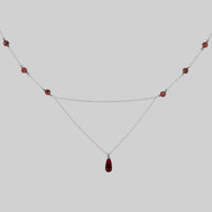 silver chain necklace with red drop and beads