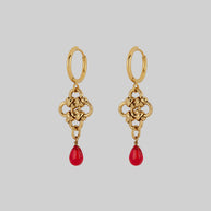 gold knotted drop earrings with red droplet