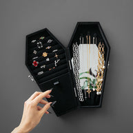 open black velvet coffin cabinet rings necklaces