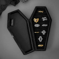 black velvet coffin case with silver gold rings zoomed out