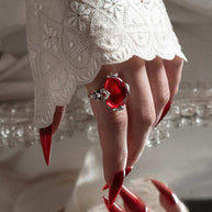 large red cabochon statement ring with fleur de lis